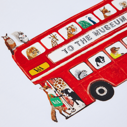 A detail of the illustration of a red London bus with several animals aboard, printed on white fabric.